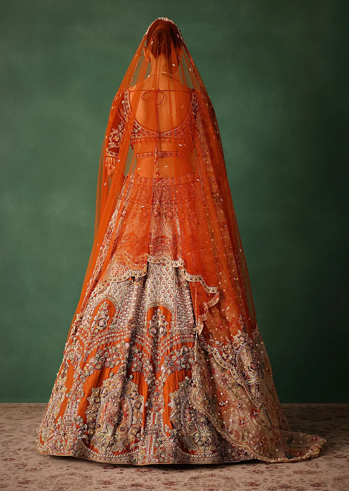 Rust V Neck Blouse With Heavy Jaal Cutdana Work Bridal Lehenga And Heavy Dupatta